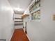 Spacious pantry with wood-look flooring and lots of shelving for optimal storage solutions at 6674 Cowan Mill Rd, Winston, GA 30187