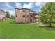 Expansive backyard featuring a covered deck, lush lawn, and well-maintained landscaping at 2619 Dayview, Atlanta, GA 30331