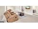 Cozy basement features a comfortable recliner and a view into other parts of the room at 2619 Dayview, Atlanta, GA 30331