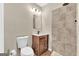 Bathroom featuring modern wood vanity, and a tiled shower stall at 2619 Dayview, Atlanta, GA 30331