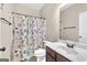 Cozy bathroom with a shower, toilet, single sink, and a colorful shower curtain at 2619 Dayview, Atlanta, GA 30331