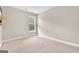 Bright bedroom features neutral carpet, base trim, and a window at 2619 Dayview, Atlanta, GA 30331