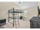 Bedroom with a bunk bed, a mounted television, and neutral walls and carpet at 2619 Dayview, Atlanta, GA 30331