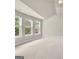 Carpeted bedroom with vaulted ceilings and three windows at 2619 Dayview, Atlanta, GA 30331