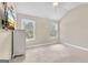 Bedroom with neutral walls and carpet, with a white dresser and two windows at 2619 Dayview, Atlanta, GA 30331