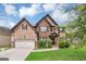 Beautiful two-story home featuring a brick and siding exterior, a well-kept lawn and mature landscaping at 2619 Dayview, Atlanta, GA 30331