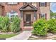 Inviting front porch with brick accents, lush greenery, and charming curb appeal at 2619 Dayview, Atlanta, GA 30331