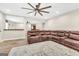 Living room with wood floors, a large sofa, and a ceiling fan at 2619 Dayview, Atlanta, GA 30331