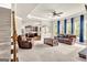Spacious living room with a ceiling fan, large windows and access to the kitchen at 2619 Dayview, Atlanta, GA 30331