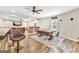 Open-concept living room with wood floors, a bar, and an adjacent poker room at 2619 Dayview, Atlanta, GA 30331