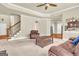 Open-concept living room with stairs, view to the kitchen, and comfortable seating at 2619 Dayview, Atlanta, GA 30331