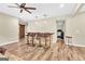 Open-concept living room with wood floors, a bar, and four stools at 2619 Dayview, Atlanta, GA 30331