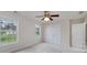 Bedroom featuring a ceiling fan, double closet, and large windows at 366 Whitney Ln, Mcdonough, GA 30253