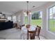 Bright dining area featuring a large window with backyard views and an access door at 366 Whitney Ln, Mcdonough, GA 30253