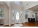 Bright and airy foyer with high ceilings, hardwood floors, and a decorative glass front door at 366 Whitney Ln, Mcdonough, GA 30253