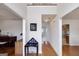 Hallway featuring hardwood floors and views into multiple rooms of the house at 366 Whitney Ln, Mcdonough, GA 30253