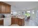 Spacious kitchen with wooden cabinets, tile flooring, and a view to the adjacent dining area at 366 Whitney Ln, Mcdonough, GA 30253