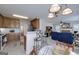 Open concept kitchen with wooden cabinetry, stainless steel appliances, and breakfast bar seating at 366 Whitney Ln, Mcdonough, GA 30253