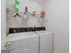 Functional laundry room with a side by side washer and dryer setup at 366 Whitney Ln, Mcdonough, GA 30253