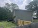 The home's backyard, features a deck with a fenced-in area for pets or children to play at 1791 Little Fawn Nw Trl, Conyers, GA 30012