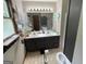This bathroom features a double sink vanity, decorative mirror, and neutral decor at 1791 Little Fawn Nw Trl, Conyers, GA 30012