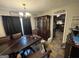 Spacious dining room with a large dining table and view into the kitchen at 1791 Little Fawn Nw Trl, Conyers, GA 30012