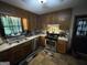 Efficient kitchen includes stainless steel appliances, wooden cabinets, and ample counter space at 1791 Little Fawn Nw Trl, Conyers, GA 30012