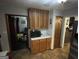 Additional kitchen area with upper cabinets, microwave and access to other rooms at 1791 Little Fawn Nw Trl, Conyers, GA 30012