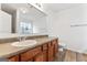 Bathroom features a large vanity with wood cabinets and a big mirror at 308 Sarasota Ln, Locust Grove, GA 30248