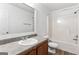 Bathroom featuring a single sink vanity, a toilet, and a shower and tub combination at 308 Sarasota Ln, Locust Grove, GA 30248