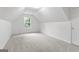 Bright bedroom with neutral carpet, complemented by a textured ceiling and natural light at 308 Sarasota Ln, Locust Grove, GA 30248