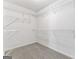 Walk-in closet with carpeted floor and wire shelving provides ample storage space at 308 Sarasota Ln, Locust Grove, GA 30248