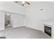 Spacious living room with high ceilings, fireplace, and view to entry at 308 Sarasota Ln, Locust Grove, GA 30248