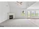 Spacious living room featuring vaulted ceilings and a cozy fireplace at 308 Sarasota Ln, Locust Grove, GA 30248