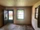 Empty living room showing wood floors and windows at 6337 Wellington Way, Austell, GA 30106