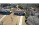 Overhead shot of the property and its surrounding landscape in a well-wooded neighborhood at 11 Grove Ln, Hampton, GA 30228