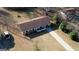 A view of the home from above showing the front porch, lawn, and driveway at 11 Grove Ln, Hampton, GA 30228