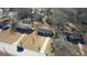 Aerial view of home situated between other properties in a peaceful, wooded neighborhood at 11 Grove Ln, Hampton, GA 30228