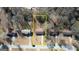 An aerial view of the home and neighborhood including a yellow box surrounding the property at 11 Grove Ln, Hampton, GA 30228