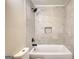 Clean, updated bathroom featuring tiled shower and tub combo and a modern shower head at 11 Grove Ln, Hampton, GA 30228