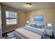 This bedroom features wood-look floors and a window, all illuminated with an abundance of natural light at 11 Grove Ln, Hampton, GA 30228