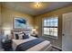 This bedroom features carpet and a window, all illuminated with an abundance of natural light at 11 Grove Ln, Hampton, GA 30228