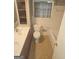 Cozy bathroom features double sink, decorative mirror, toilet and tiled shower-tub combo at 2527 Amalfi Dr, Conyers, GA 30012