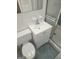 Tidy bathroom with a tiled floor, toilet, sink, and glass-enclosed shower at 2527 Amalfi Dr, Conyers, GA 30012