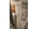 Well-lit bathroom featuring a vanity, shelving, and a standing shower at 2527 Amalfi Dr, Conyers, GA 30012