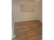 Bright bedroom features hardwood floors, a window with wooden shutters, and white walls at 2527 Amalfi Dr, Conyers, GA 30012