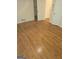 Hardwood floored bedroom featuring white trim and two doors at 2527 Amalfi Dr, Conyers, GA 30012