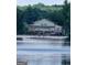 Gorgeous lake house features a private dock and spacious outdoor living areas at 2527 Amalfi Dr, Conyers, GA 30012