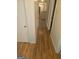 Hallway showcases hardwood floors and leads to a bright, open living area at 2527 Amalfi Dr, Conyers, GA 30012