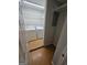 Functional laundry room features a washer, dryer, and built-in shelving at 2527 Amalfi Dr, Conyers, GA 30012